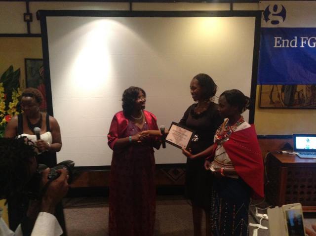 Christine Ghati (Centre) receiving a certificate from Anti-FGM chair Dr. Jebii Kilimo during The Guardian Media End FGM academy Graduation at the Serena Hotel, Nairobi.